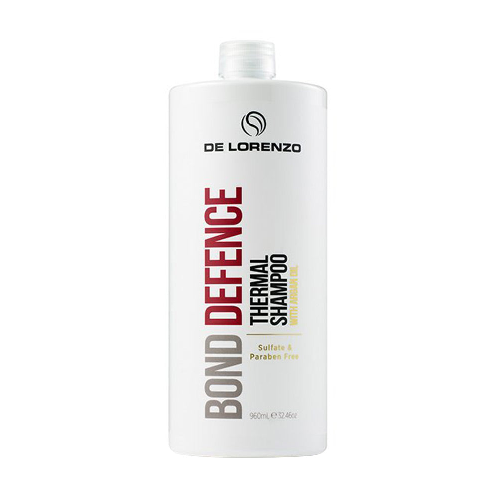 A 960ml bottle of De Lorenzo Bond Defence Thermal Shampoo with a pump dispenser, predominantly white in color with red and grey text and accents.