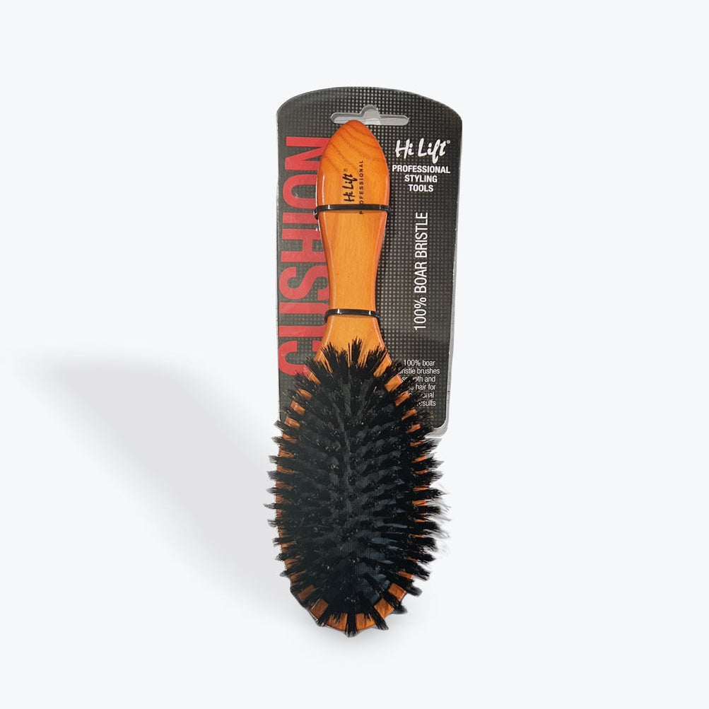 Hairbrush with black bristles and orange handle on a white background