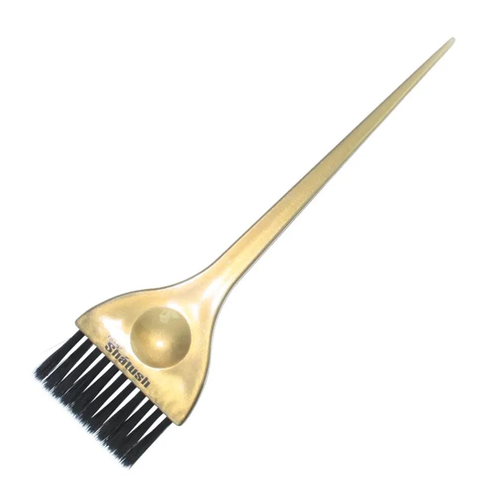 Hair dye brush with black bristles and gold handle on a white background