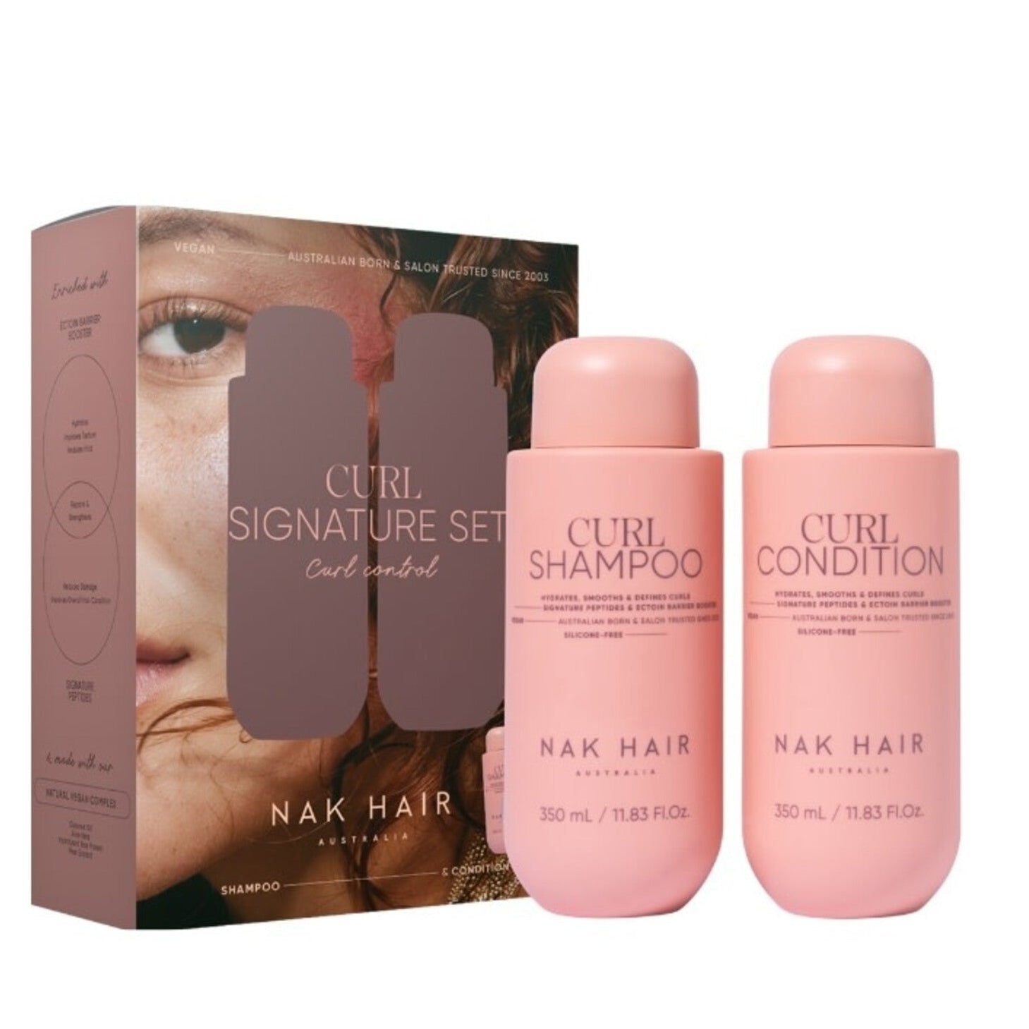 Nak Hair Curl Signature Set with shampoo and conditioner bottles and packaging on a white background