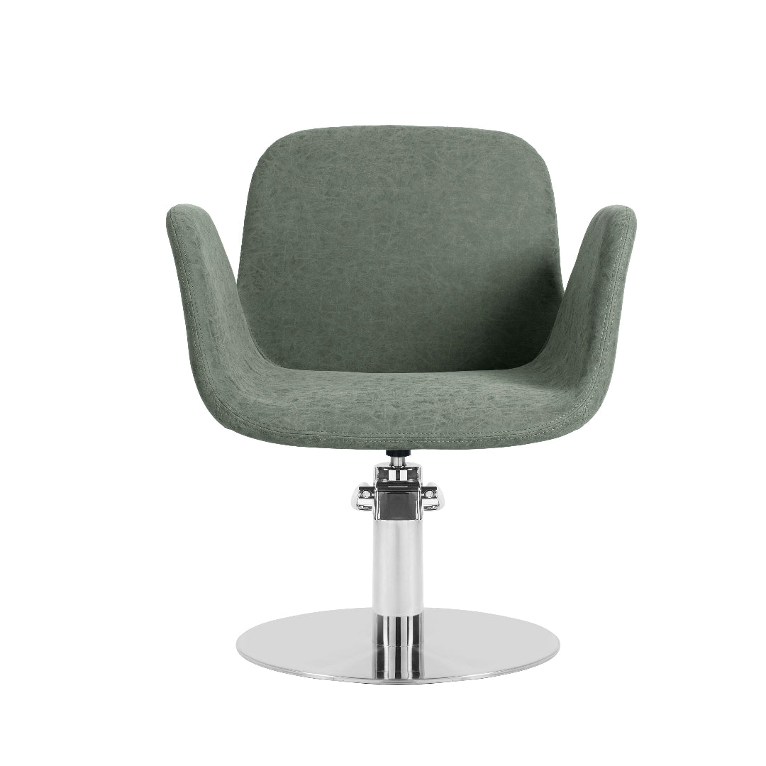 A modern swivel salon chair upholstered in textured sage green fabric, mounted on a polished chrome pedestal base with a circular footrest, shown against a plain white background.