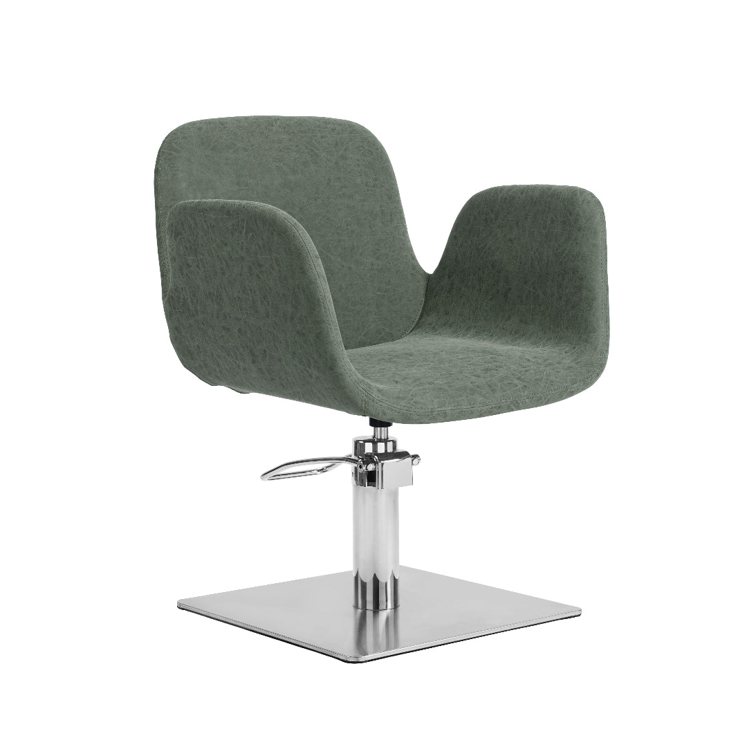 A modern salon chair with a textured sage green upholstered seat and backrest, supported by a chrome-plated hydraulic lift base with a square platform.